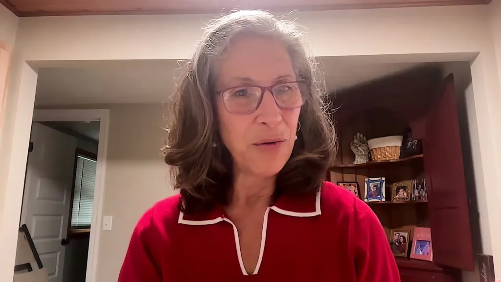 Dr. Robin Pierucci in a red and white top.