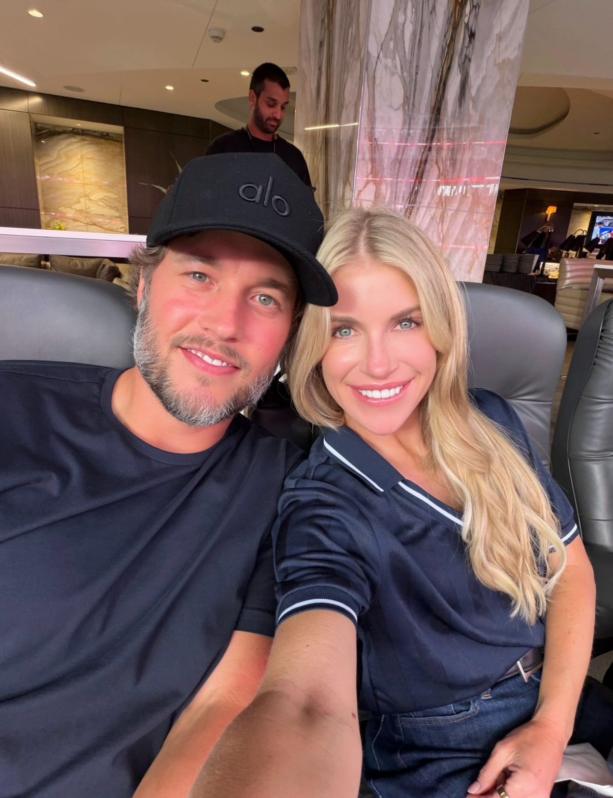 Matt Stafford and his wife Kelly smile for a selfie.