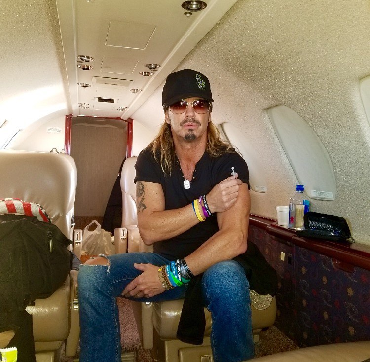 Bret Michaels sitting in a private jet.