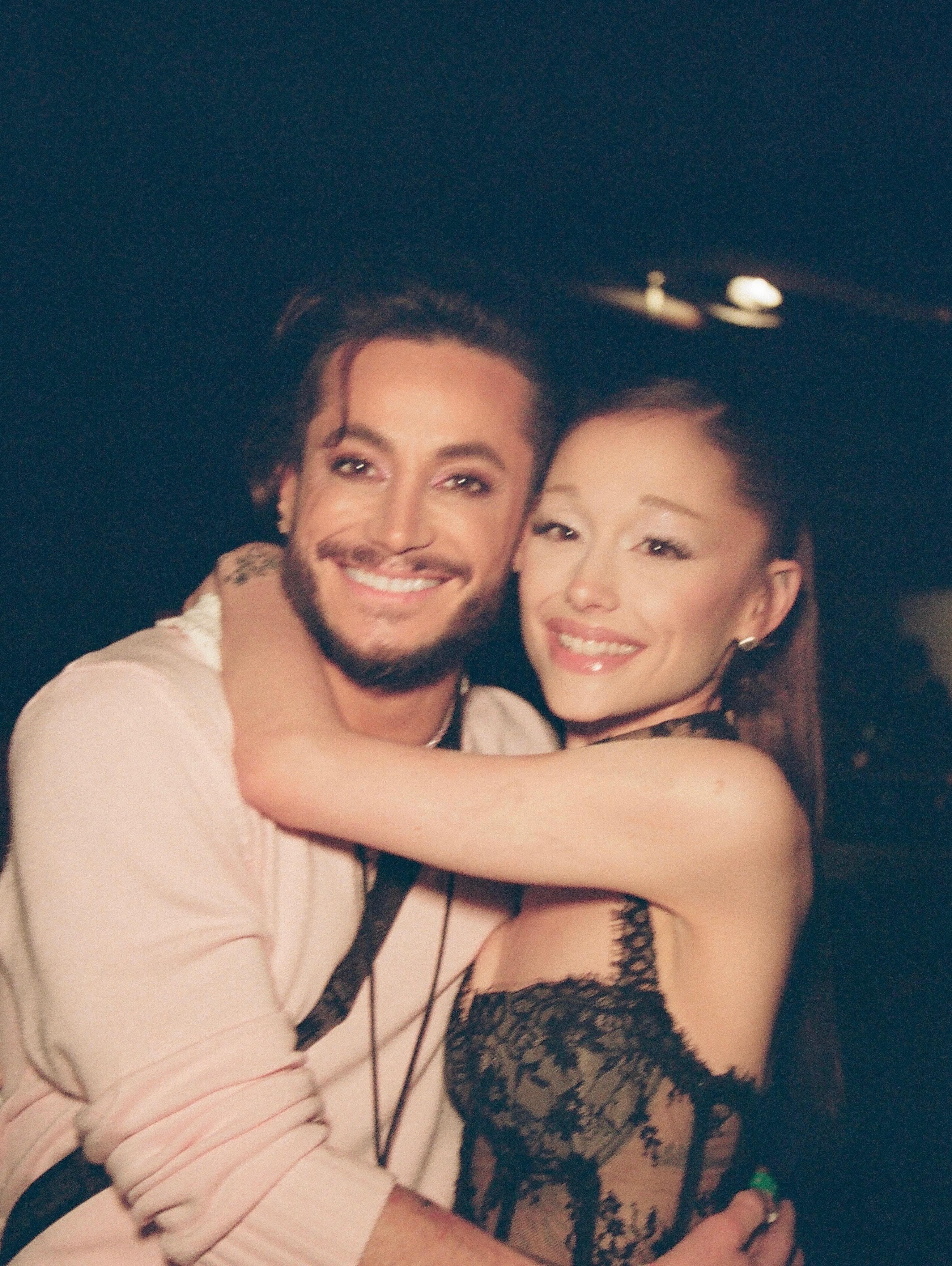 Ariana and Frankie Grande smiling and hugging.