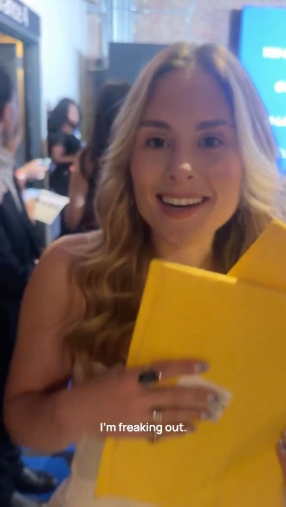 Taylor Palmby holding Jason Sudeikis's old mail.