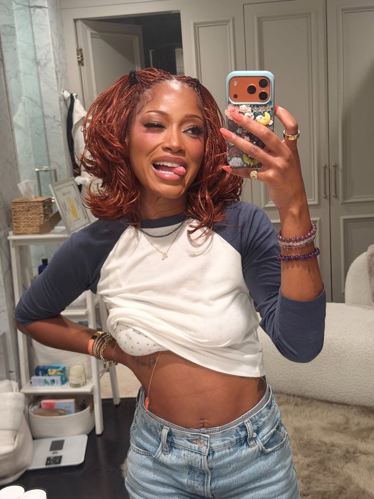 Keke Palmer winking, sticking out her tongue, and holding a phone in a mirror selfie.
