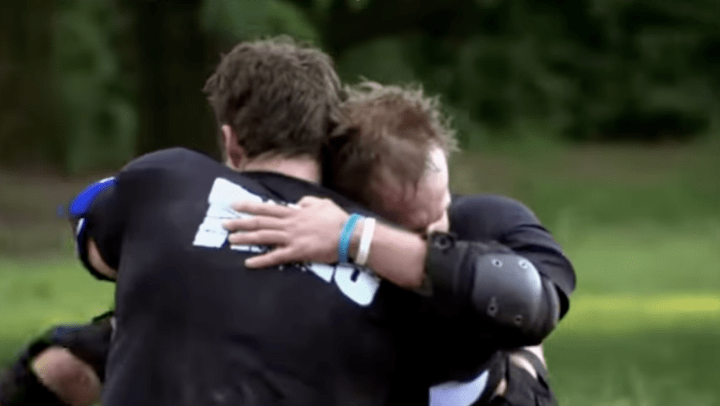 Johnny Bananas hugging Tyler Duckworth.