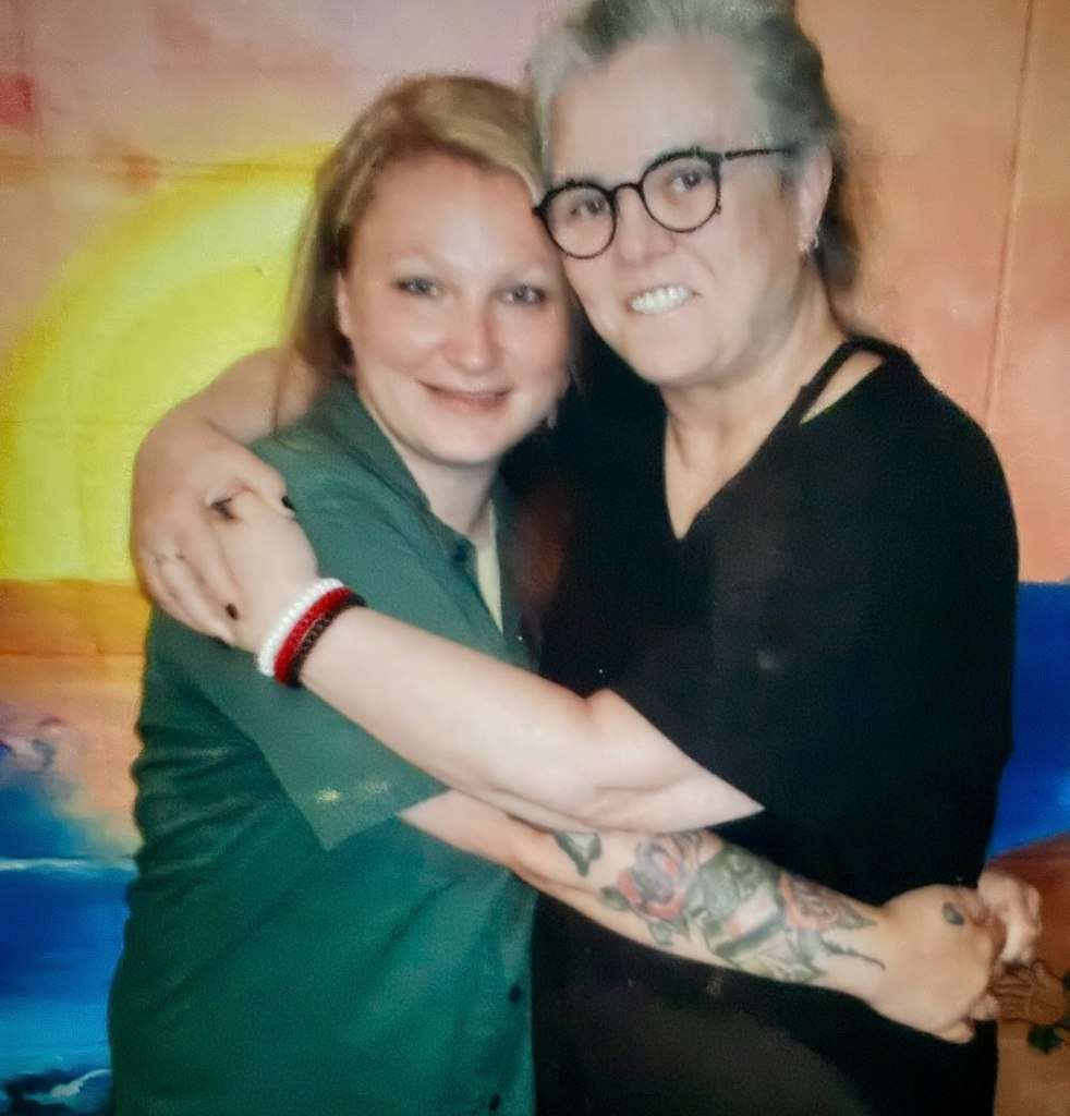 Rosie O'Donnell and daughter Chelsea embracing.