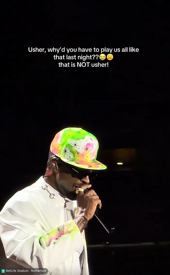 A person in a bright neon and white outfit performing on stage, with text questioning if it's Usher.