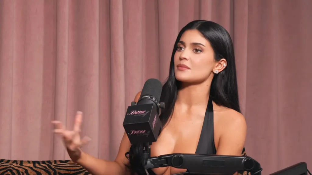 Kylie Jenner sitting next to a microphone with 