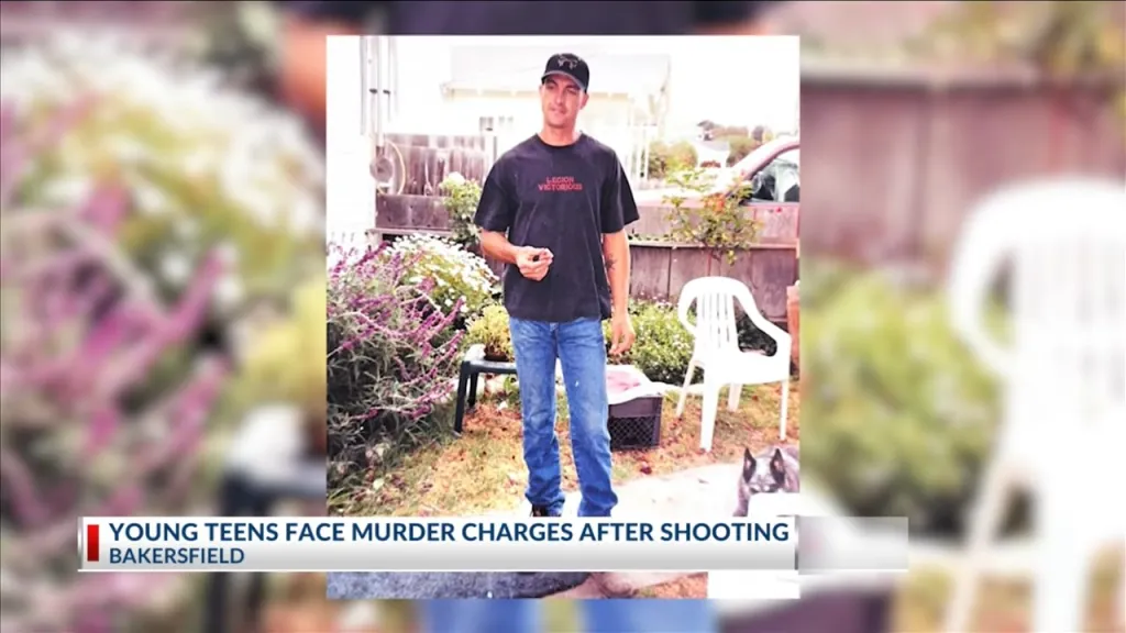 Eric Lancaster, victim of a shooting in east Bakersfield, stands in a backyard.