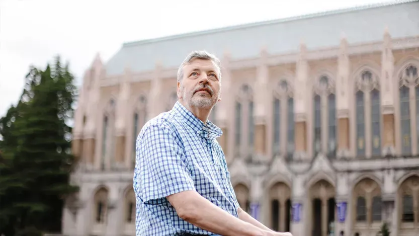 Stuart Reges, a University of Washington professor, stands outside a building on campus.