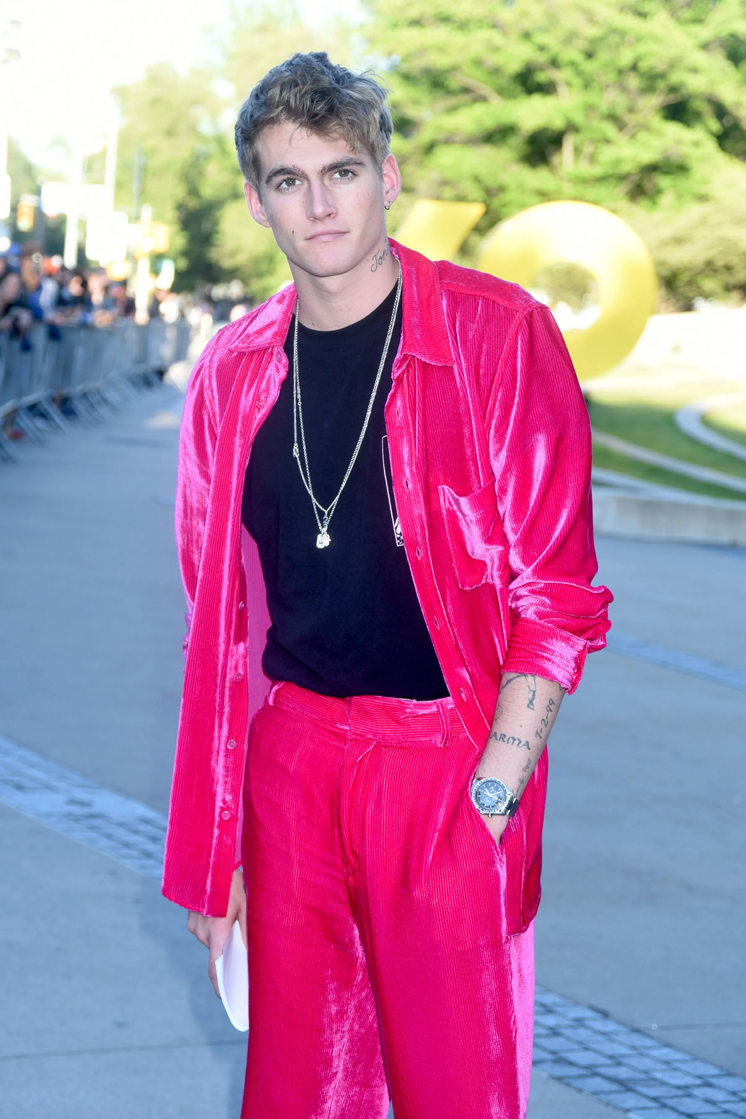 Presley Gerber in a bright pink corduroy suit.
