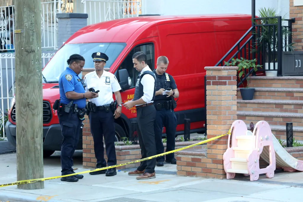 New York City police investigate a stabbing scene at 882 Albany Avenue in Flatbush.