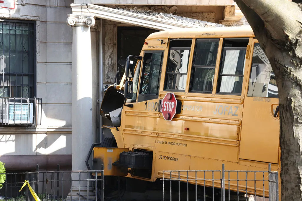The school bus driver slammed into the Eastern Parkway building around 7:20 a.m. Thursday, police said.