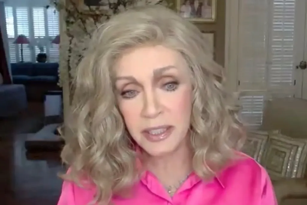 Donna Mills, wearing a hot pink shirt, speaking.