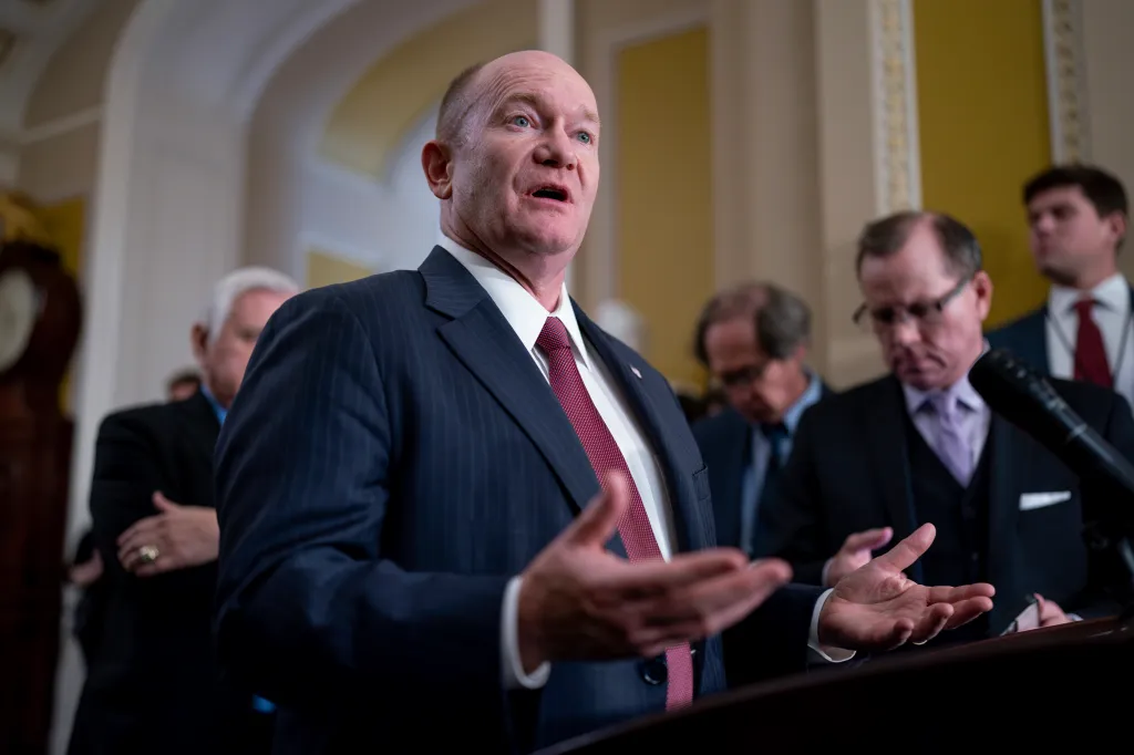 Sen. Chris Coons joins Senate Majority Leader Chuck Schumer (D-NY) to speak with reporters outside the Senate chamber at the Capitol in Washington on Nov. 28, 2023.