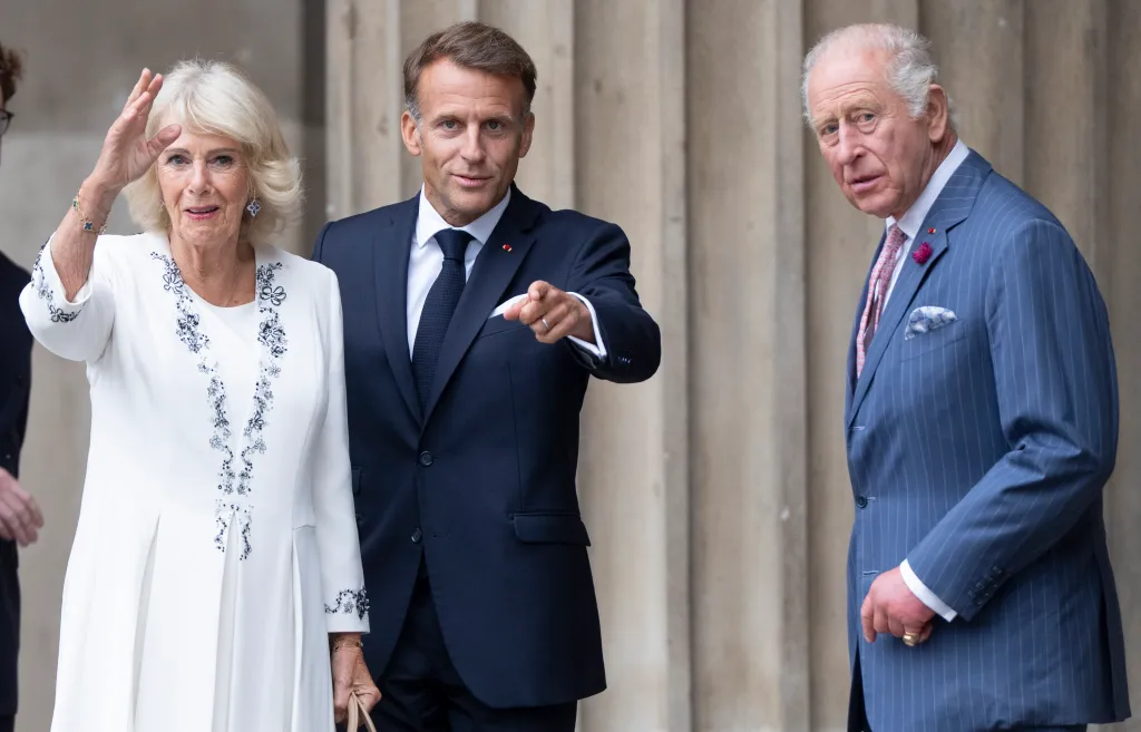 Queen Camilla, Emmanuel Macron, and King Charles III viewing the Bayeux Tapestry exhibition.