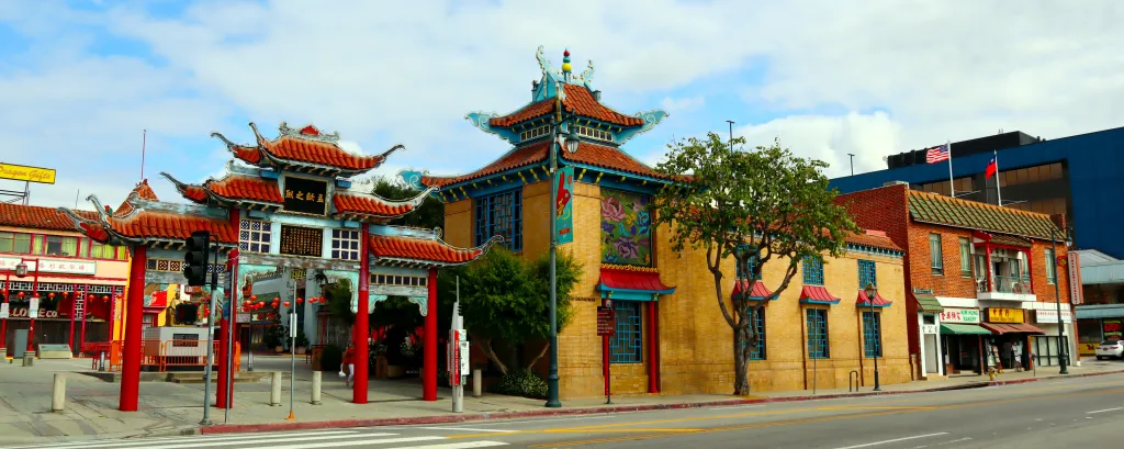 View of Chinatown in downtown Los Angeles with traditional Chinese architecture and an American flag.