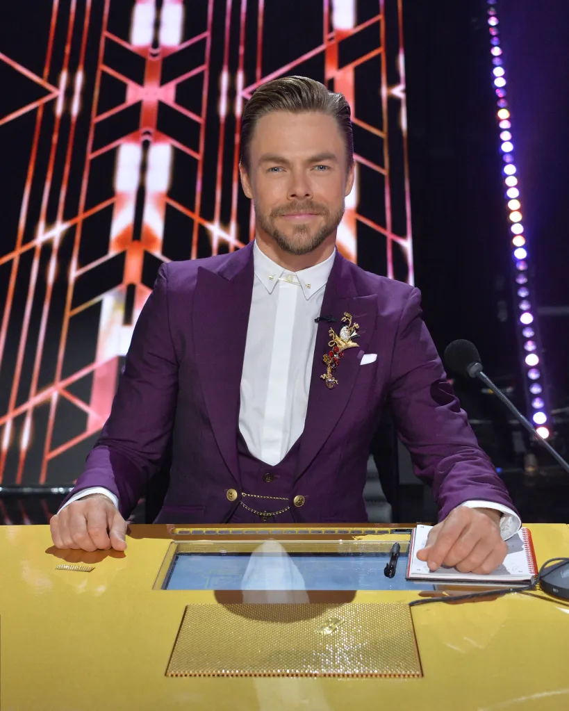 Derek Hough at the judges' table during 