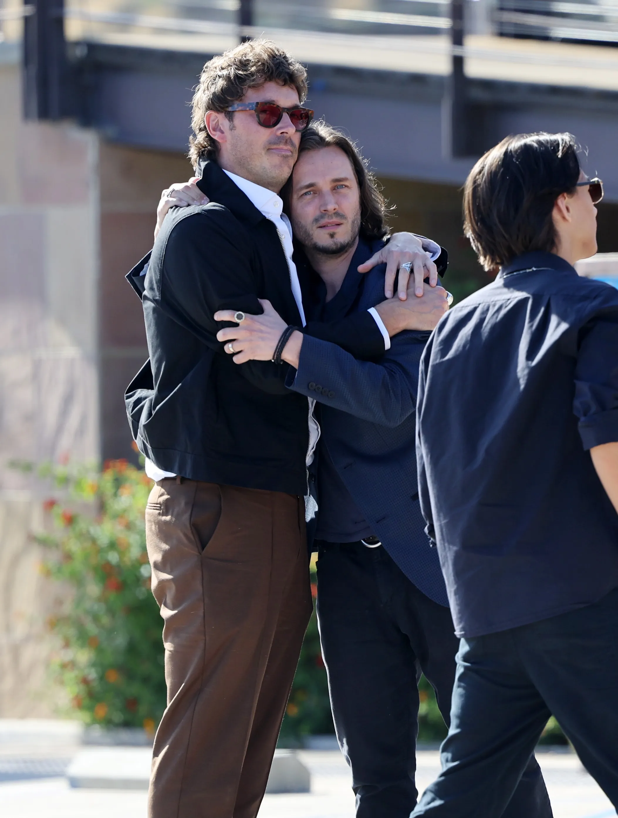 Sam Palladio comforting Jonathan Jackson.