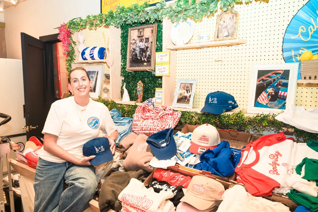 Nicole Ponti holding a baseball cap with