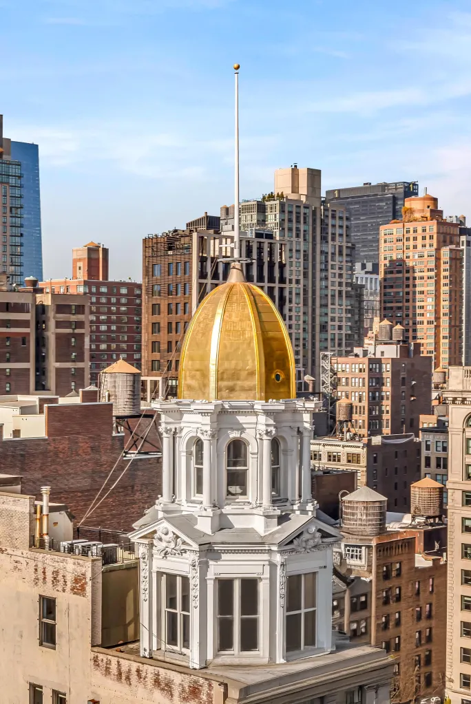A gold-domed penthouse atop the Sohmer Piano Building at 170 Fifth Ave. has sold for $9 million, a stunning 64% drop from the $25 million it fetched on the market when it debuted in November 2024.