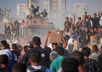 U.N. food agency halves West Bank aid because of funding shortages, warns new cuts may be needed