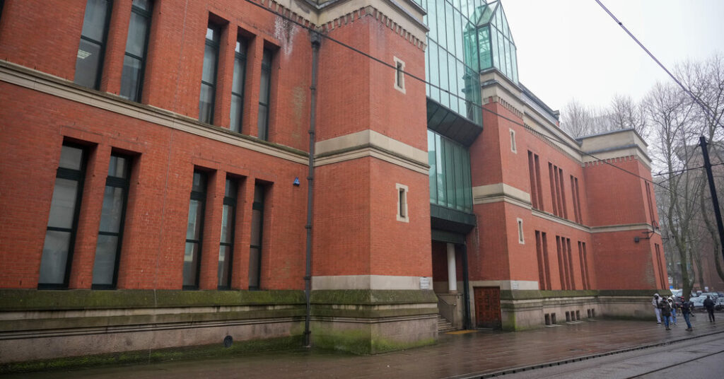 Husband and 12 Men in Britain Are Accused of Woman’s Yearslong Drugging and Rape