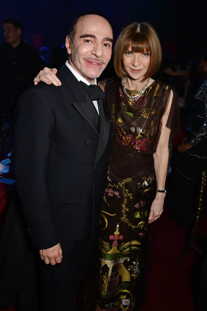John Galliano and Anna Wintour pose together at an awards after-party.