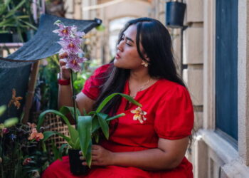 She turns orchids from her tiny garden into jewelry that looks like art