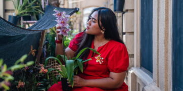 She turns orchids from her tiny garden into jewelry that looks like art