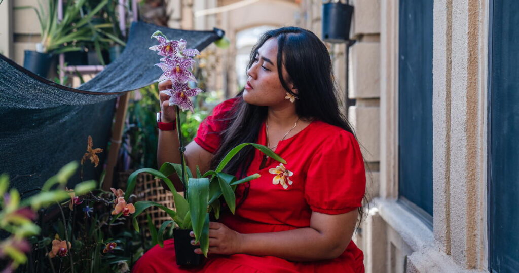She turns orchids from her tiny garden into jewelry that looks like art