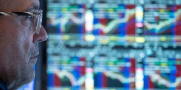 Tech stocks lead a rally on Wall Street as bond yields ease some more