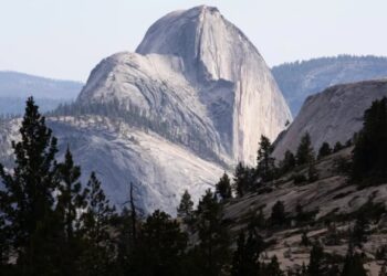 As wildfires and floods batter national parks, a developer says it’s negotiating for a piece of Yosemite