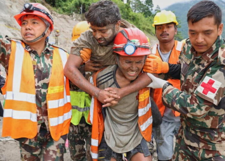 Rescuers pull 2 trapped workers from a hydropower tunnel 9 days after Nepal floods