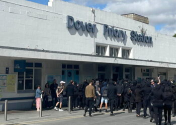 Masked men block roads into Dover port in England in anti-immigrant protest