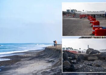 California beach swallowed by furious surf as Labor Day weekend crowds face parking nightmare