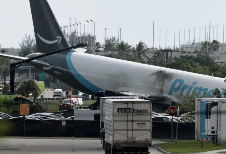 Amazon cargo plane barrels off runway, crashing into multiple vehicles and forcing Miami International Airport to ground all flights