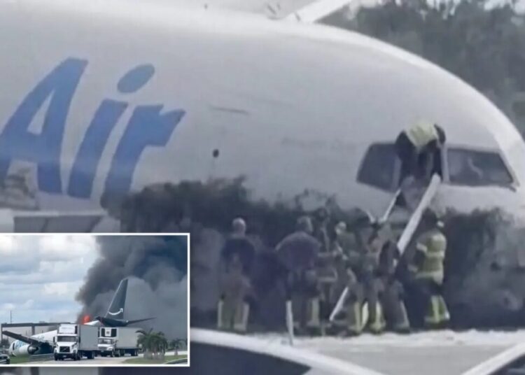 Miami firefighters seen climbing into Amazon cargo jet after shouting on dispatch ‘The plane is on fire’