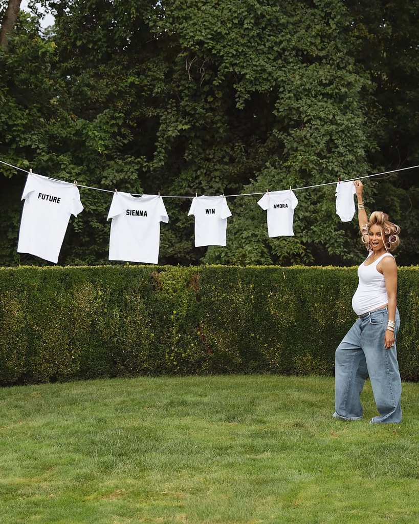 Ciara stands pregnant in a garden with t-shirts for her children Future, Sienna, Win, and Amora hanging on a clothesline.