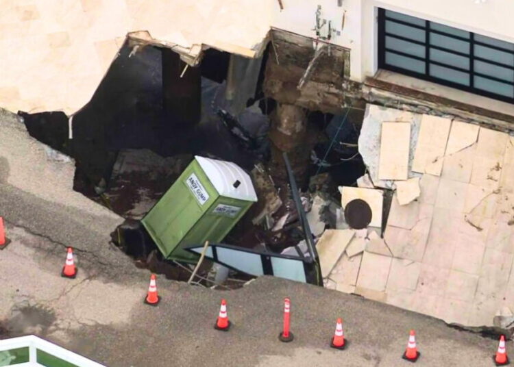 Malibu driveway collapses into massive sinkhole as coastal flood risks persist