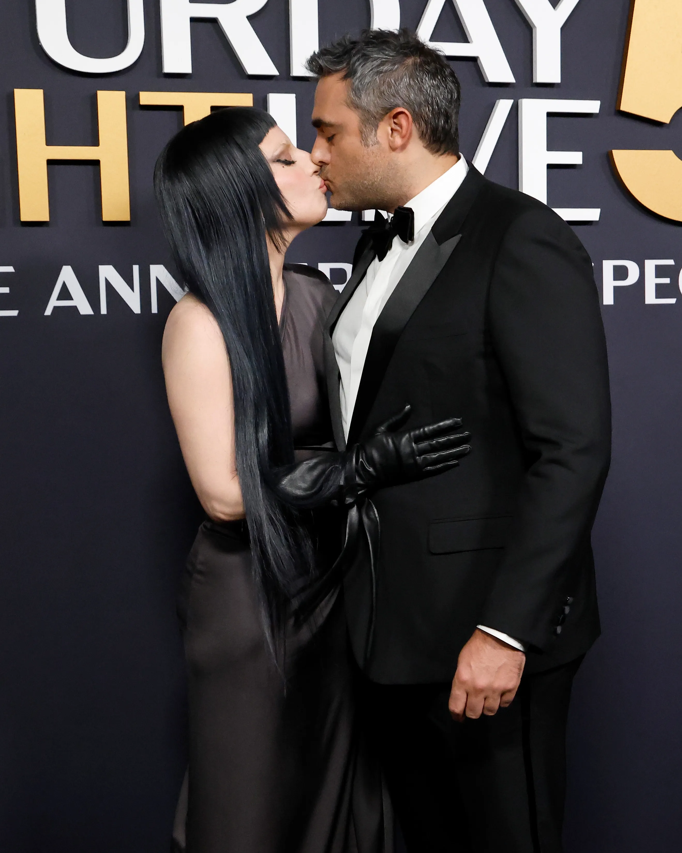 Lady Gaga and Michael Polansky kissing at the SNL50: The Anniversary Special.