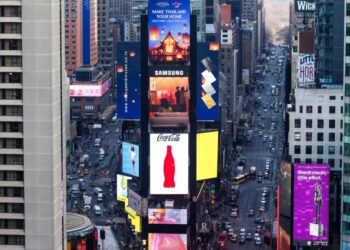 Shocking video shows wrong-way BMW racing off, hurling armed cop to ground in Times Square