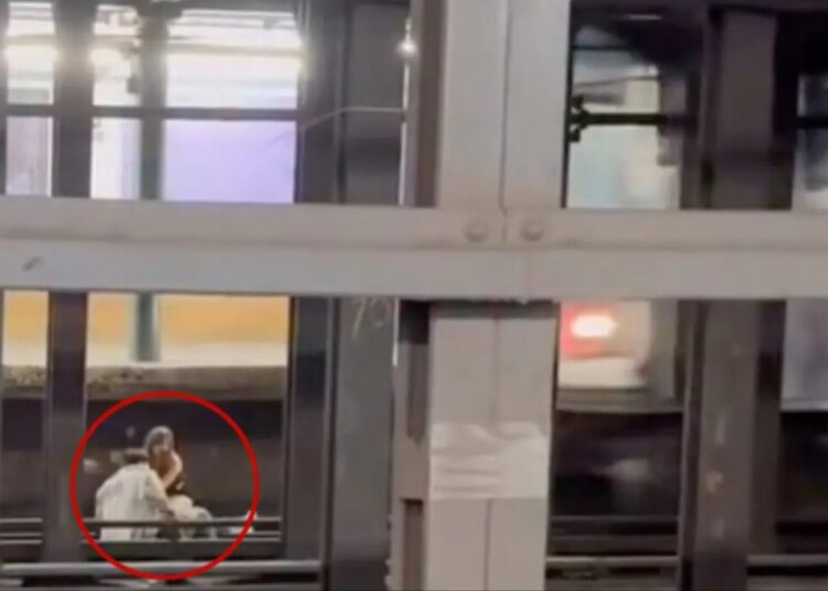 Young man and woman caught on video sitting on NYC subway tracks before being fatally struck 