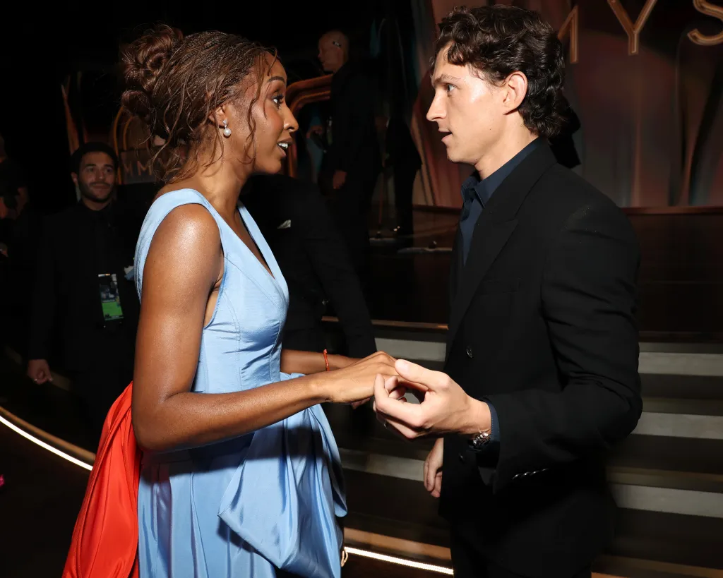 Ayo Edebiri and Tom Holland talking at the 78th Primetime Emmy Awards.