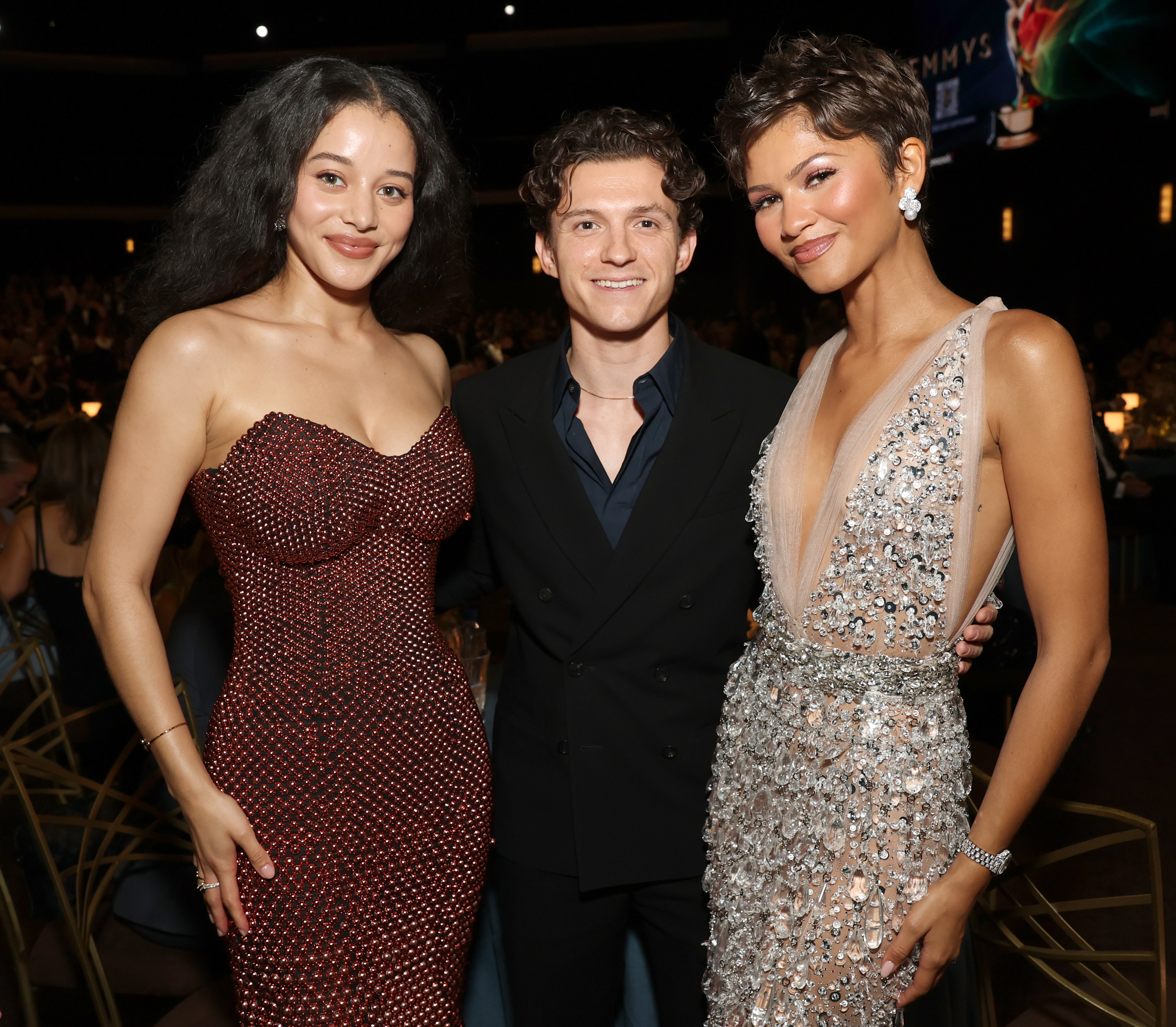 Chase Infiniti, Tom Holland, and Zendaya posing at the 78th Primetime Emmy Awards.