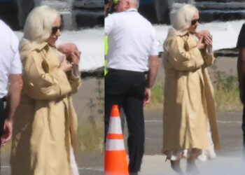 Glam Lady Gaga cradles her baby as she touches down in LA with fiancé Michael Polansky