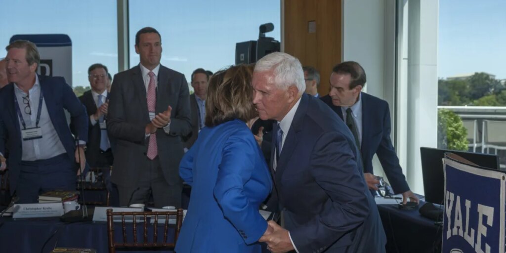 Exclusive: Inside the room where Nancy Pelosi and Mike Pence shared an emotional embrace in front of America’s leadership class