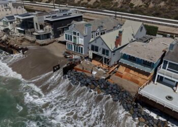 Fight intensifies over the fate of homes falling into the sea