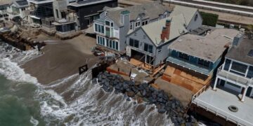 Fight intensifies over the fate of homes falling into the sea
