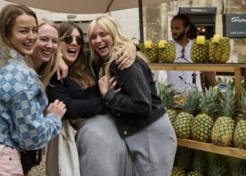 The bank account says no while the Europe group chat says YOLO. Gen Z is cutting spending—but not on little treats and last-minute trips