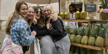 The bank account says no while the Europe group chat says YOLO. Gen Z is cutting spending—but not on little treats and last-minute trips