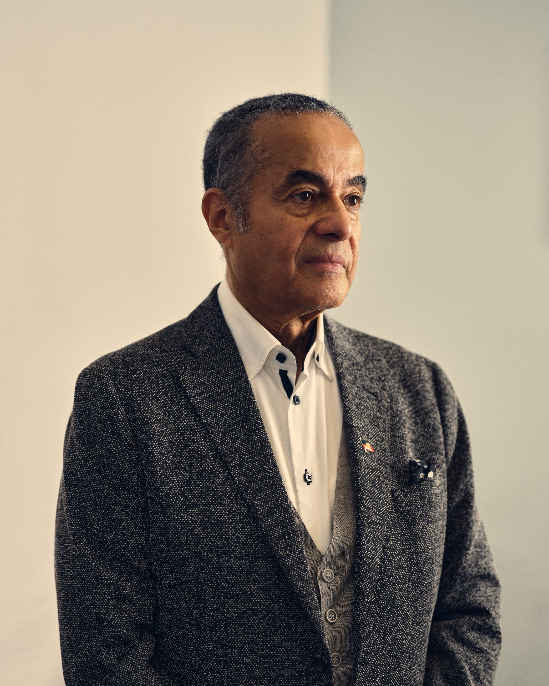a man stands in a suit